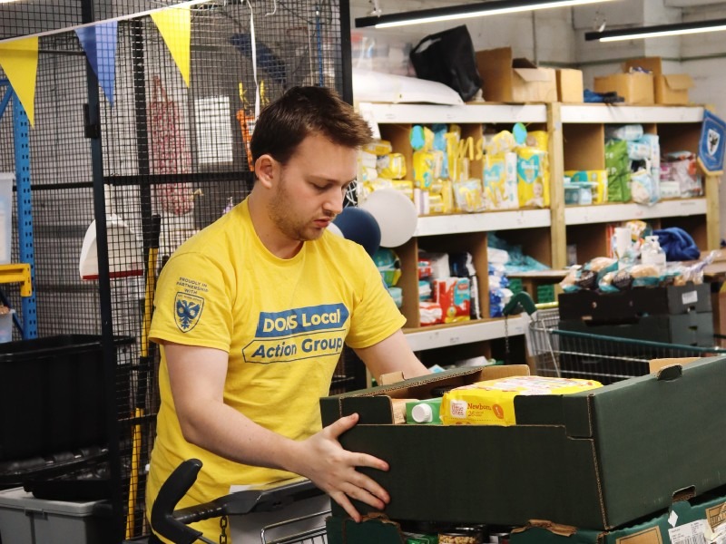 Team Member Packing Food Box